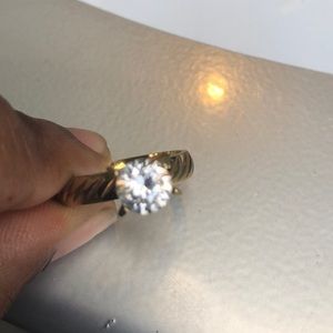 A gold ring with small diamond